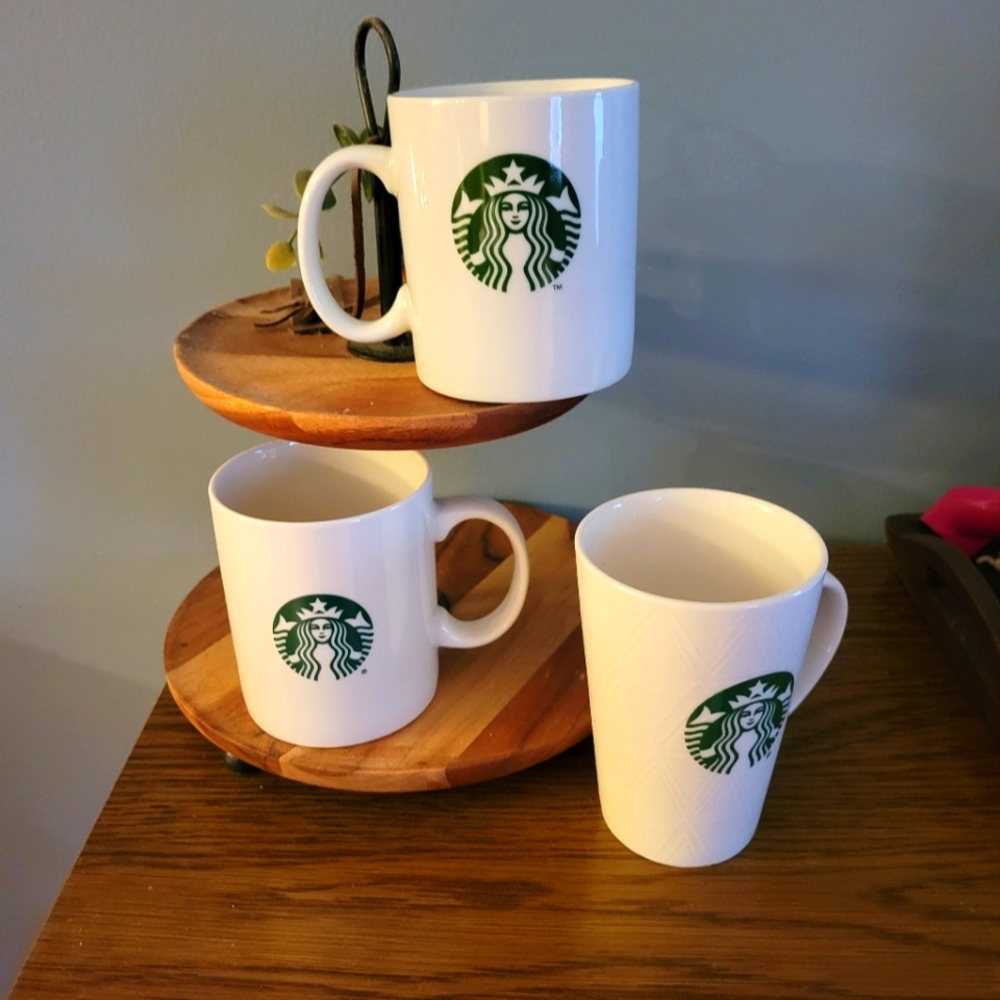 Set of three ceramic starbucks mugs.